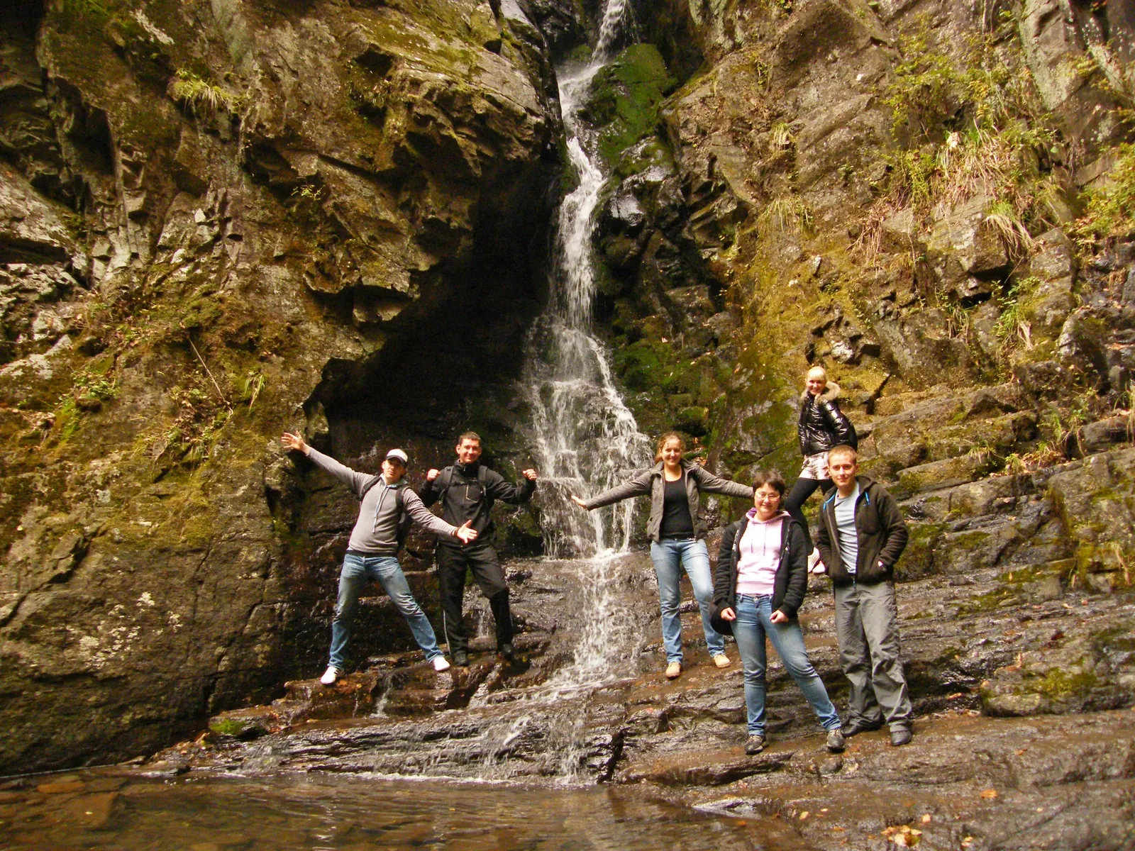 By a mountain waterfall