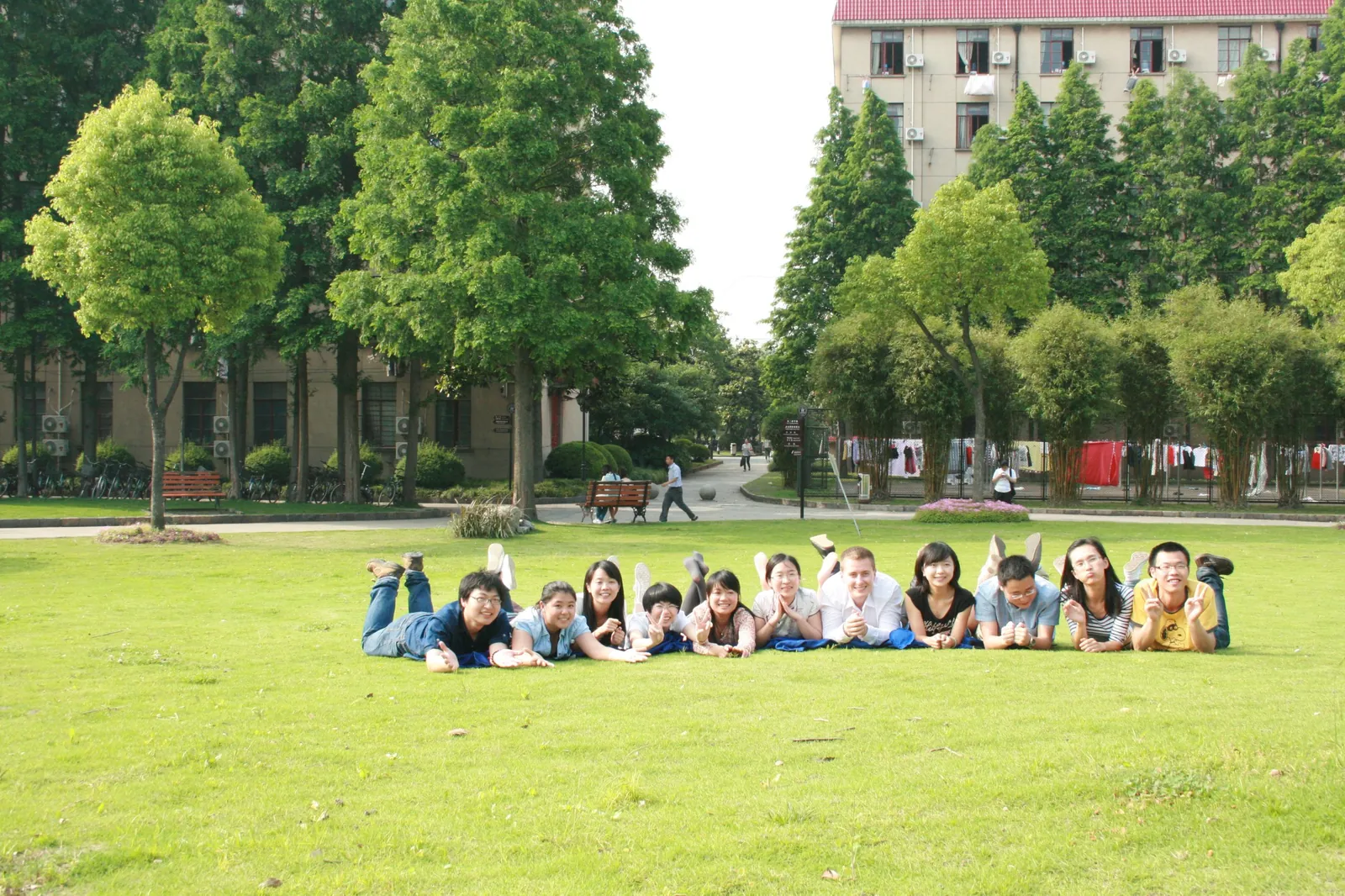 With classmates on the campus lawn