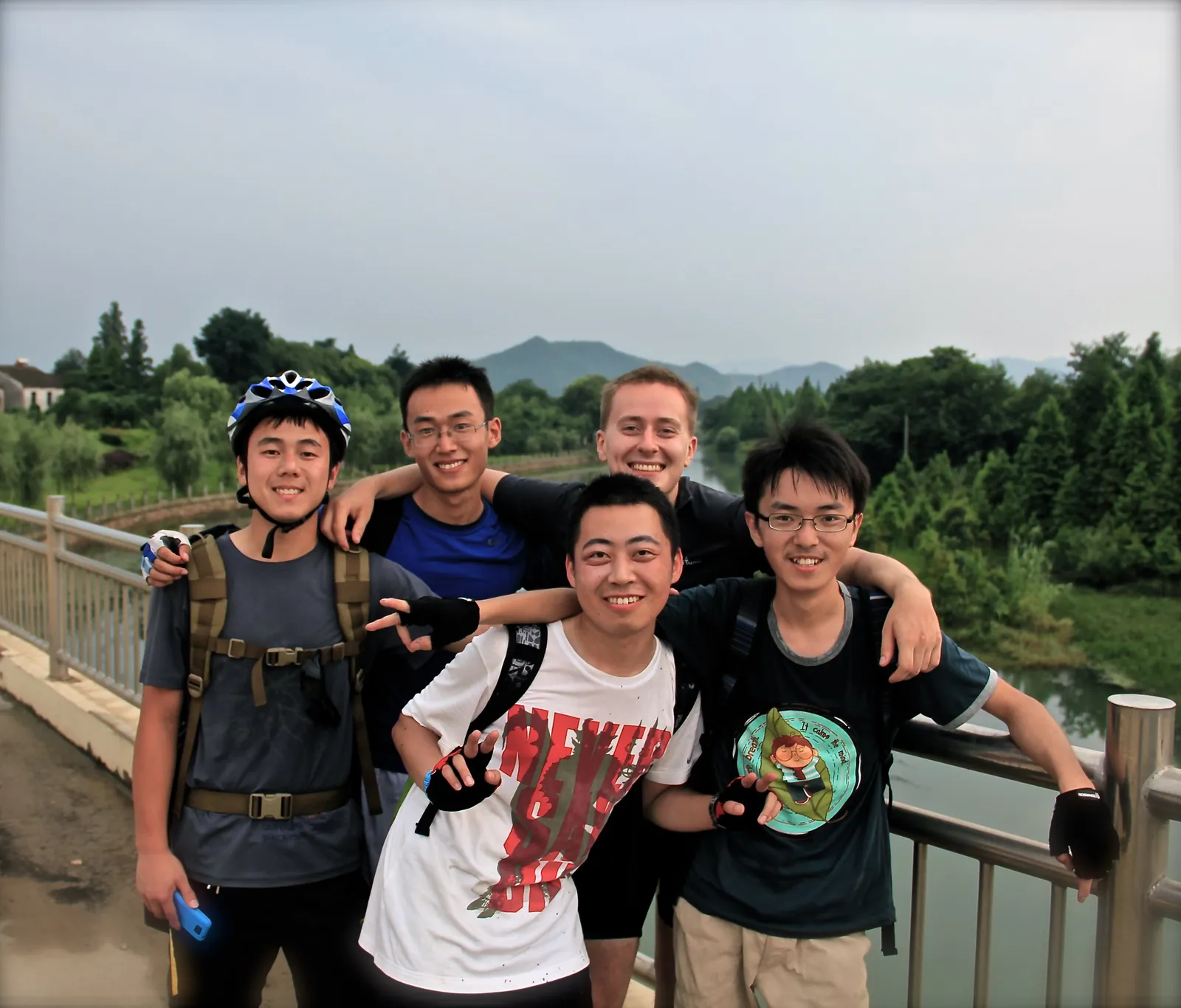 With cycling club friends on a bridge