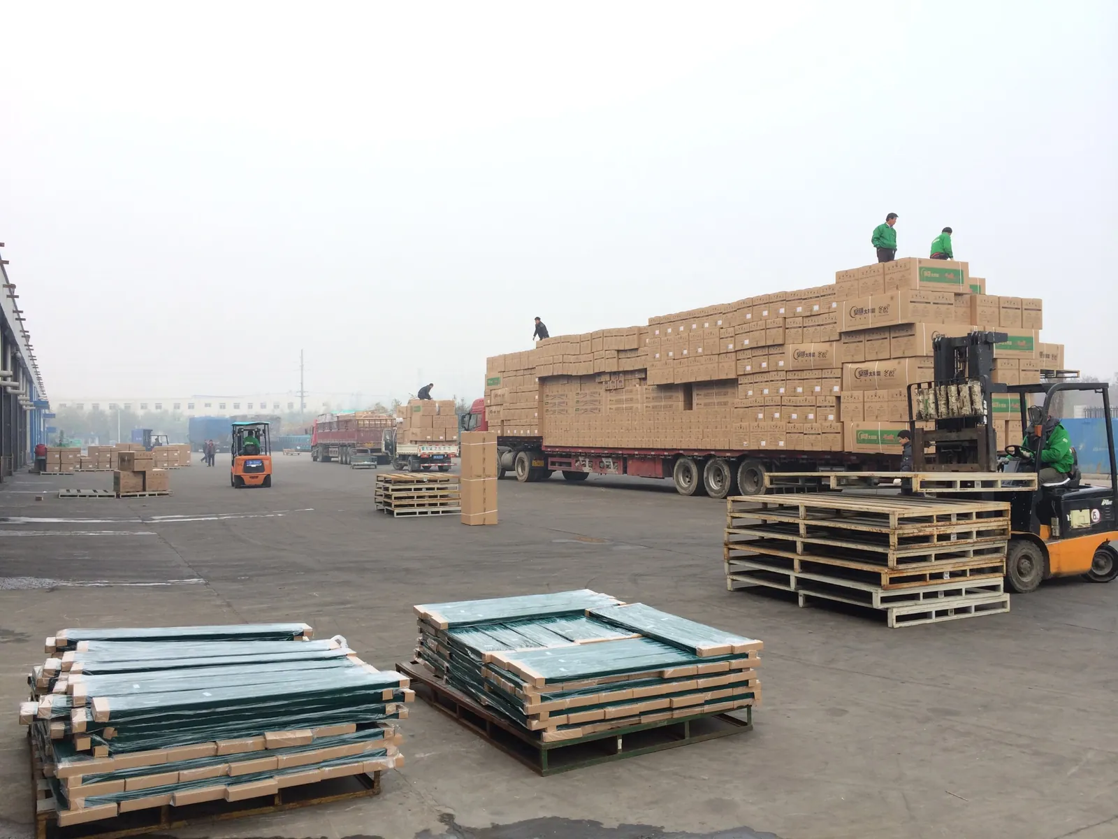 Loading goods onto trucks at a factory warehouse