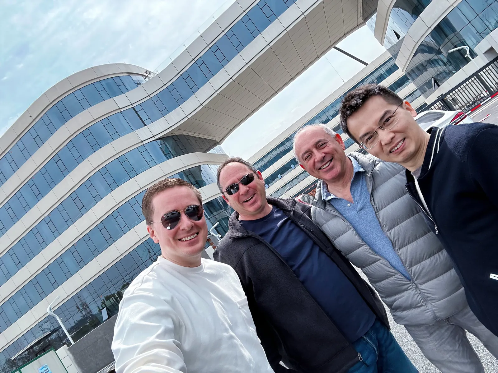 With partners by a finished building