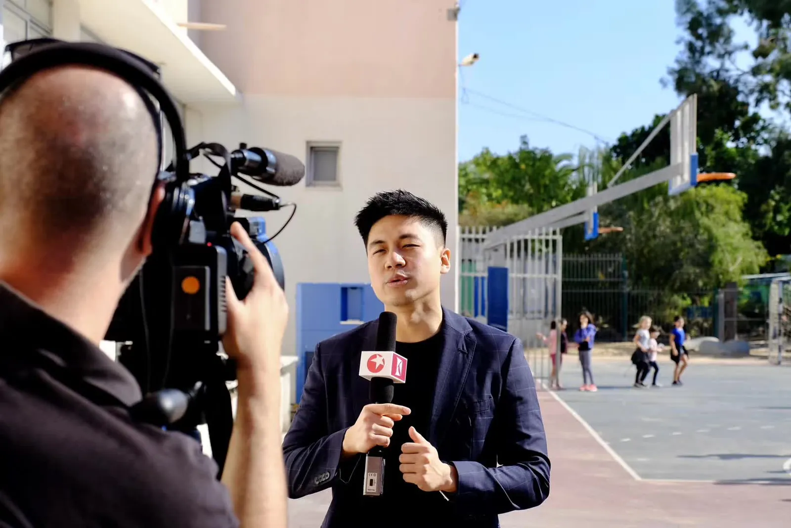 Chinese TV filming a report