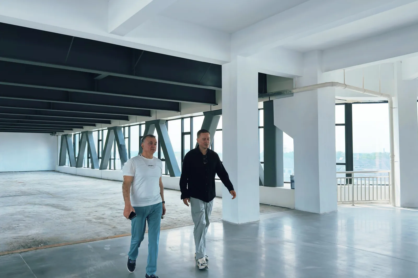 Walking a guest through a finished technology park building