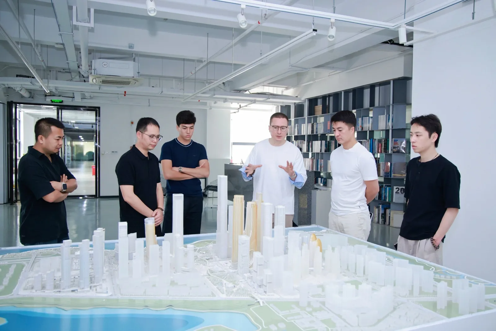 Discussing an urban development project over a model