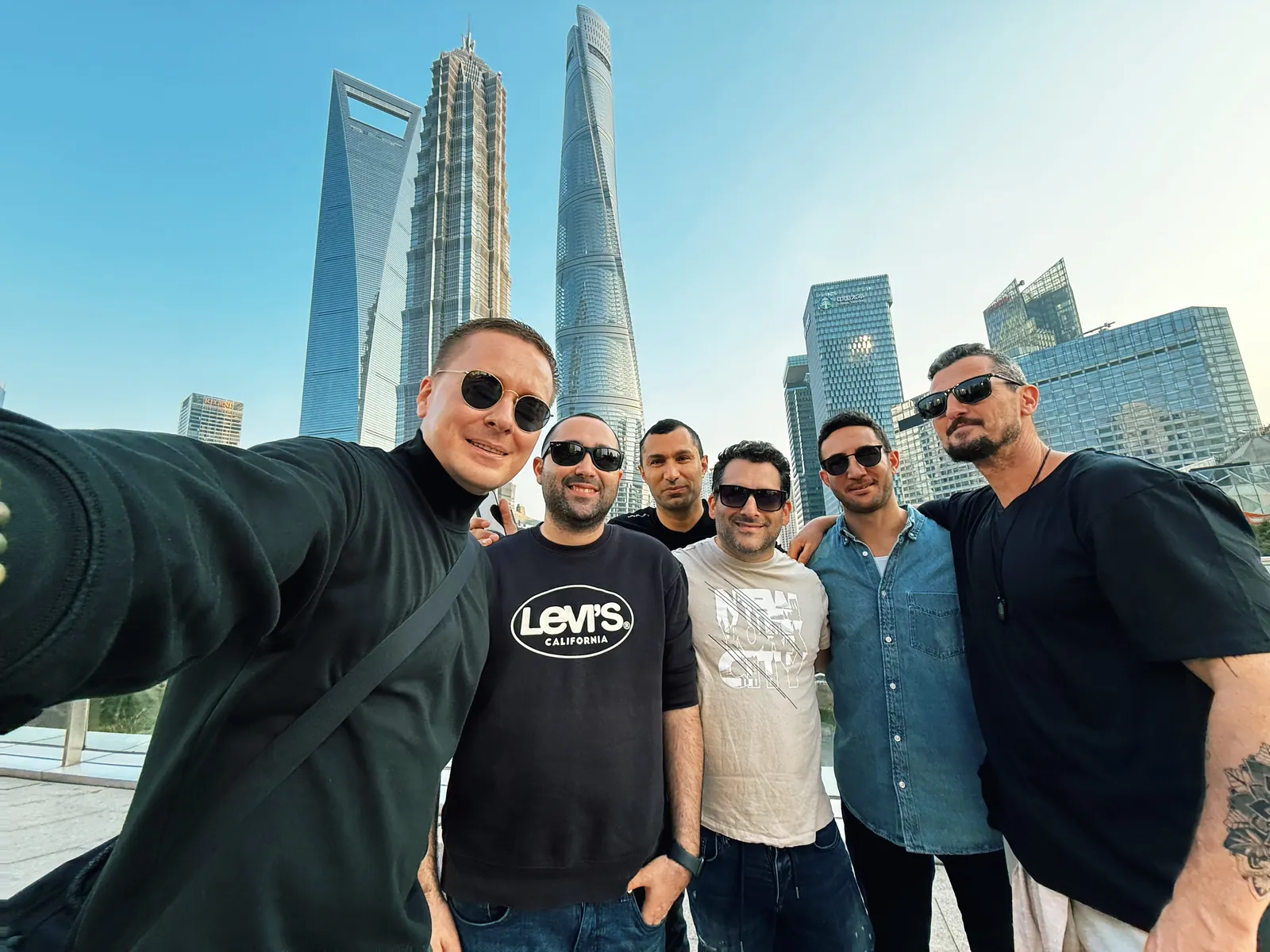 The group with the Lujiazui skyline behind