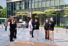 Meeting Chinese partners outside a business center